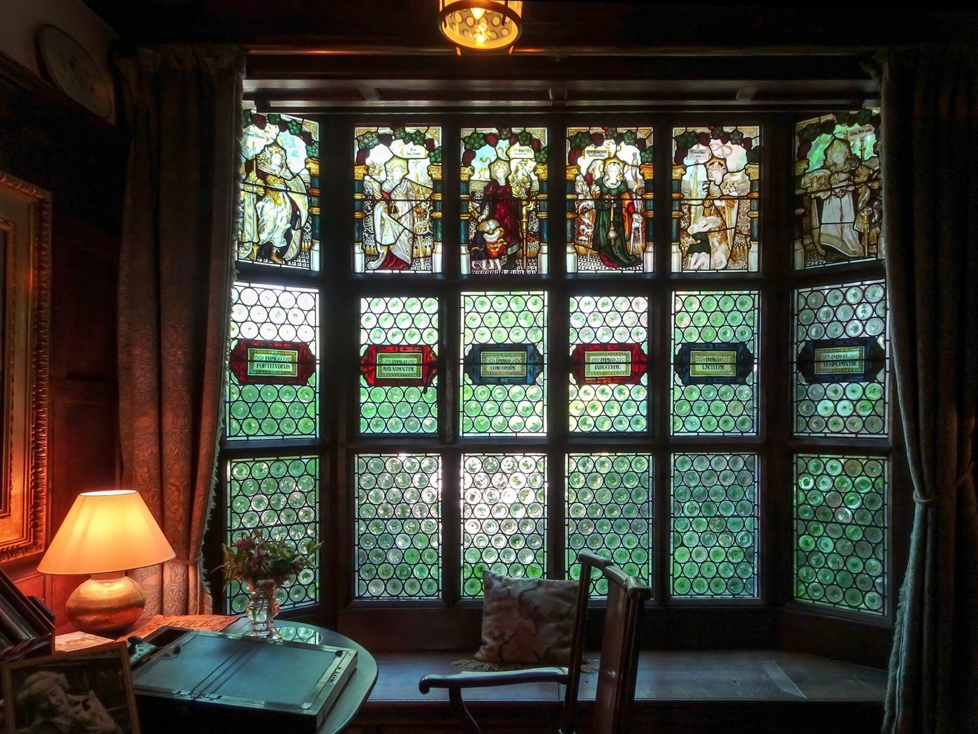The entrance hall at Wightwick Manor: Kempe stained glass and Morris-patterned textiles in the artistic interior