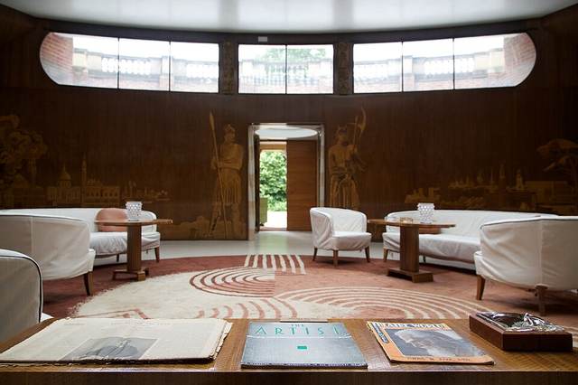 Eltham Palace entrance hall with wood marquetry, curved walls and a glazed circular dome