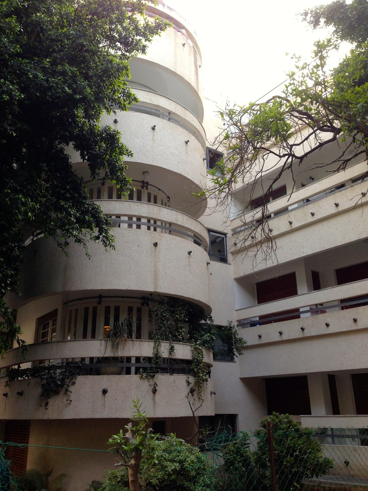 White City apartment buildings in Tel Aviv, white modernist blocks with strip windows and balconies