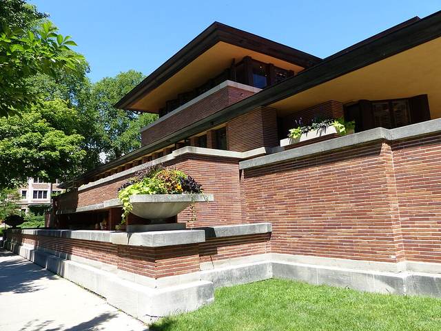 Robie House in Chicago with long eaves and art glass bands