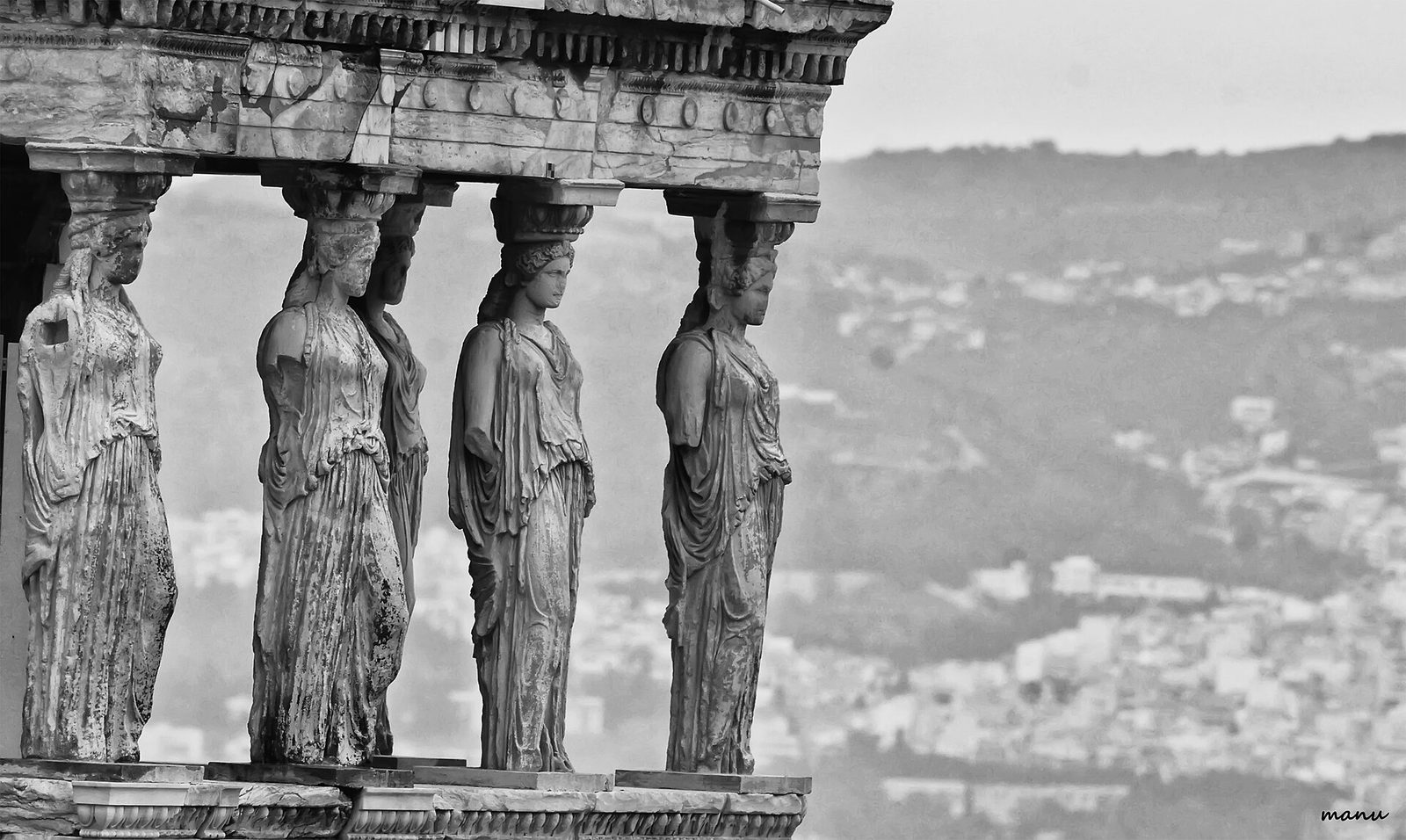 The Caryatids of the Erechtheion: draped female figures carrying the porch entablature