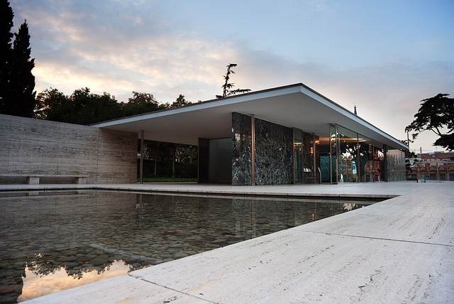 Barcelona Pavilion in Barcelona, marble and onyx screens, glass walls and flat roof beside the reflecting pool